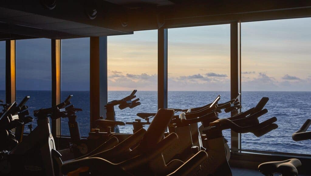 View of the ocean from B Complex Bike, the part of our gym dedicated to cycling, as the sun sets.