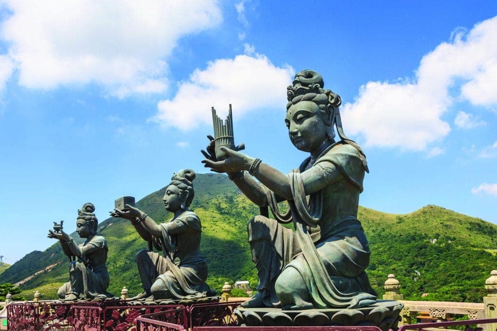 Statues of Devas making offerings at Tian Tan Buddha image on Lantau Island, Hong Kong