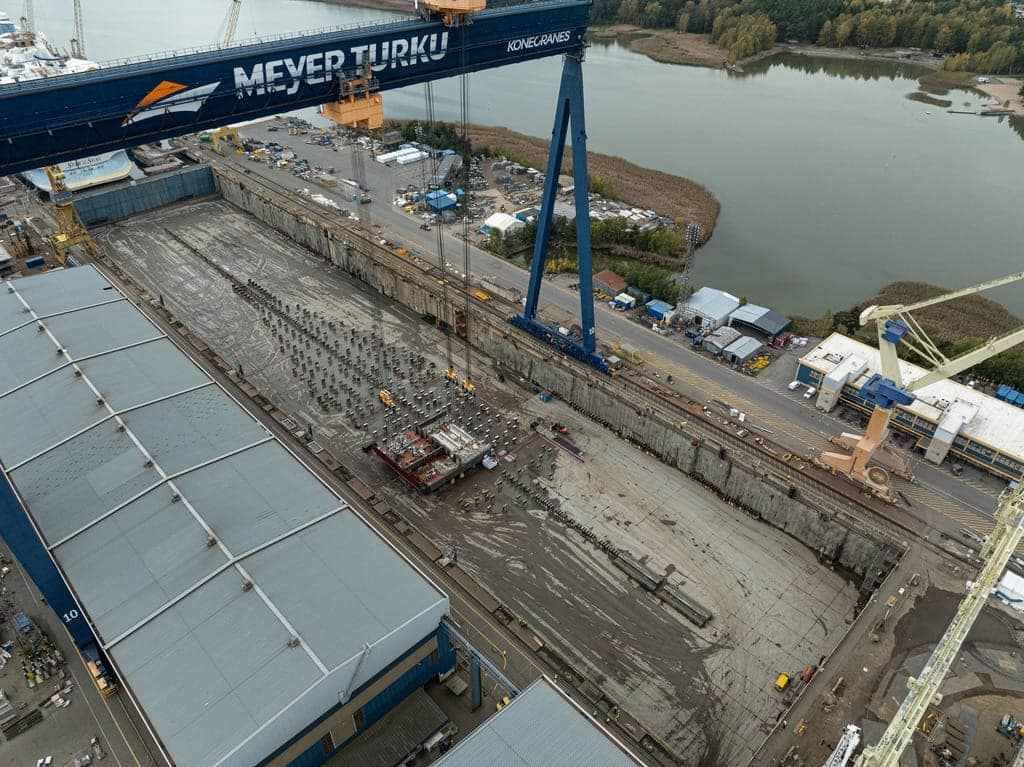 Royal Caribbean International kicked off the start of physical construction on the third Icon Class vacation that debuts in 2026. A keel-laying celebration took place at Finnish shipyard Meyer Turku, where the first block of the soon-to-be-named ship was lifted and placed onto a layer of freshly minted coins.