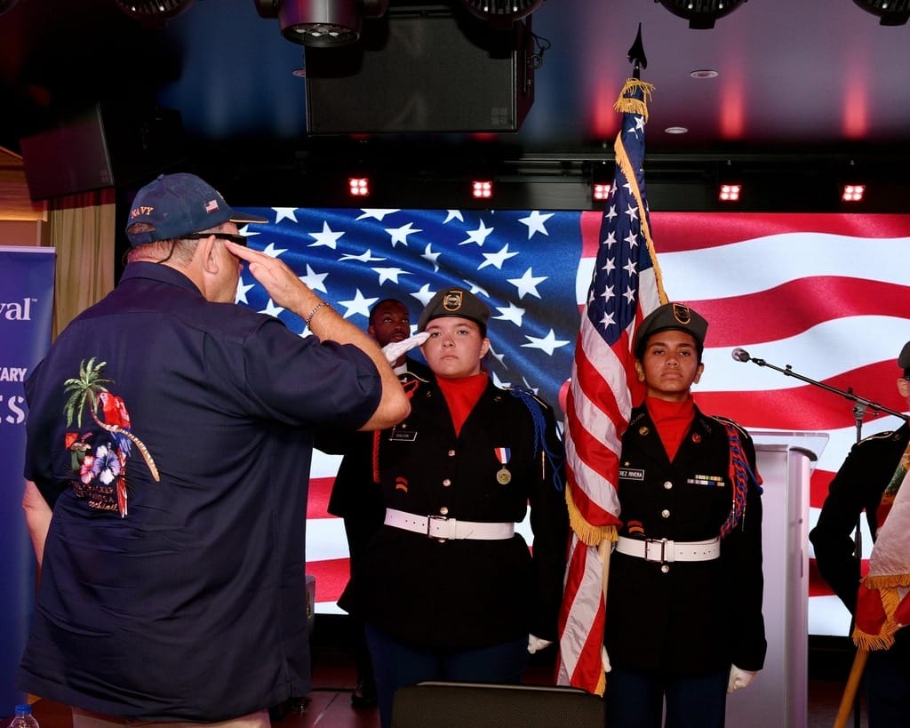 Veteran salutes East River Falcon Battalion Color Guard