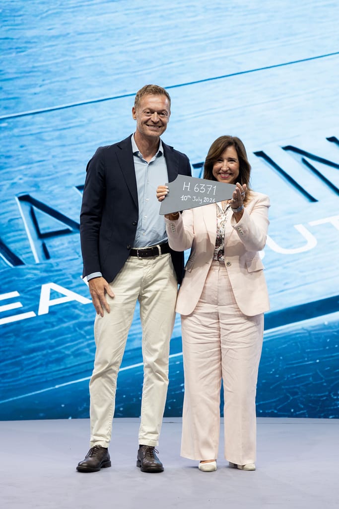 Director of Monfalcone Shipyard Cristiano Bazzra with Carnival Cruise Line President Christine Duffy hold first piece of steel to celebrate start of construction