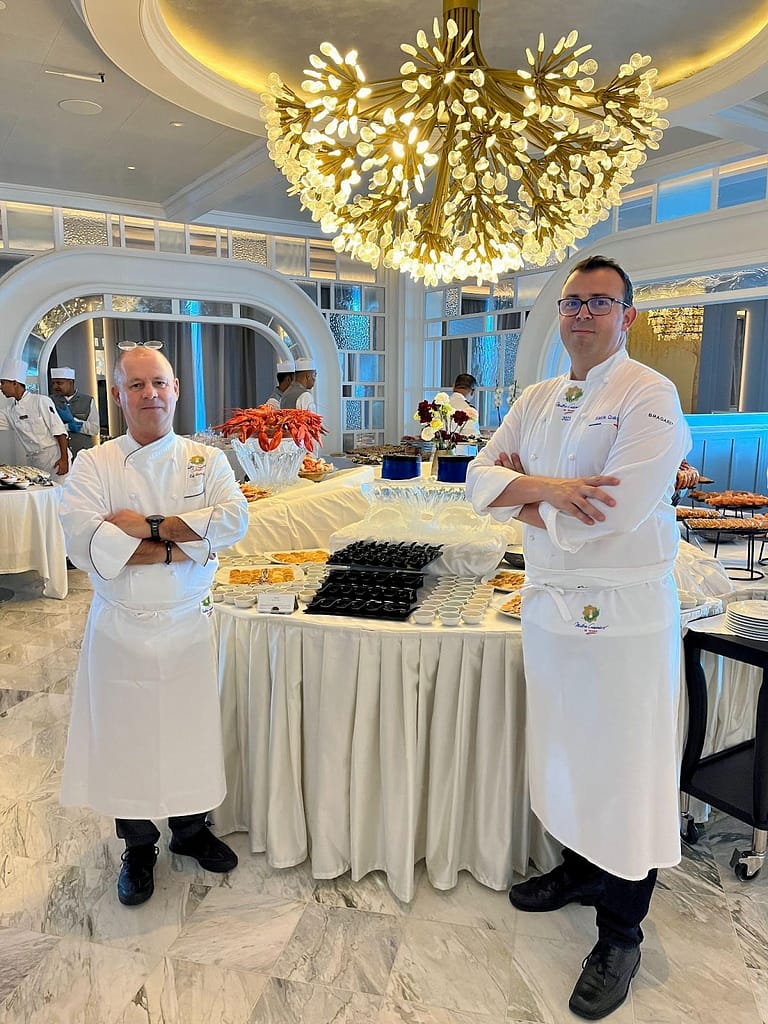 Chef Eric Barale and Chef Alexis Quaretti During Brunch Service in The Grand Dining Room on board Oceania Cruises’ newest ship, Vista.