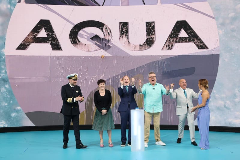 Norwegian Aqua Christening Celebration (L-R) Captain Robert Lundberg, Harry Sommer, President and CEO of Norwegian Cruise Line Holdings Ltd, Stella David, Chairperson, Board of Directors for Norwegian Cruise Line Holdings, Eric Stonestreet, two-time Emmy® Award Winner and godfather to the new Norwegian Aqua, David J. Herrera, President of Norwegian Cruise Line and Allison Hueman Norwegian Aqua Hull Artist attend the Norwegian Cruise Line Officially Christens Norwegian Aqua In Miami And Reveals Expansion Plans For Great Stirrup Cay, The Brand's Private Island Destination on April 13, 2025 in Miami, Florida.