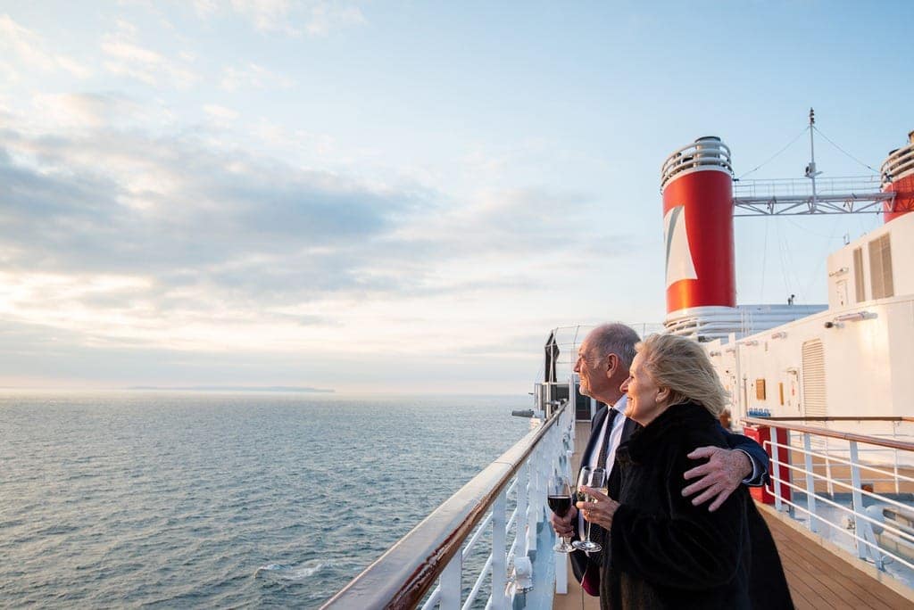 red. Olsen Cruise Line Guests cruising Iceland on Bolette