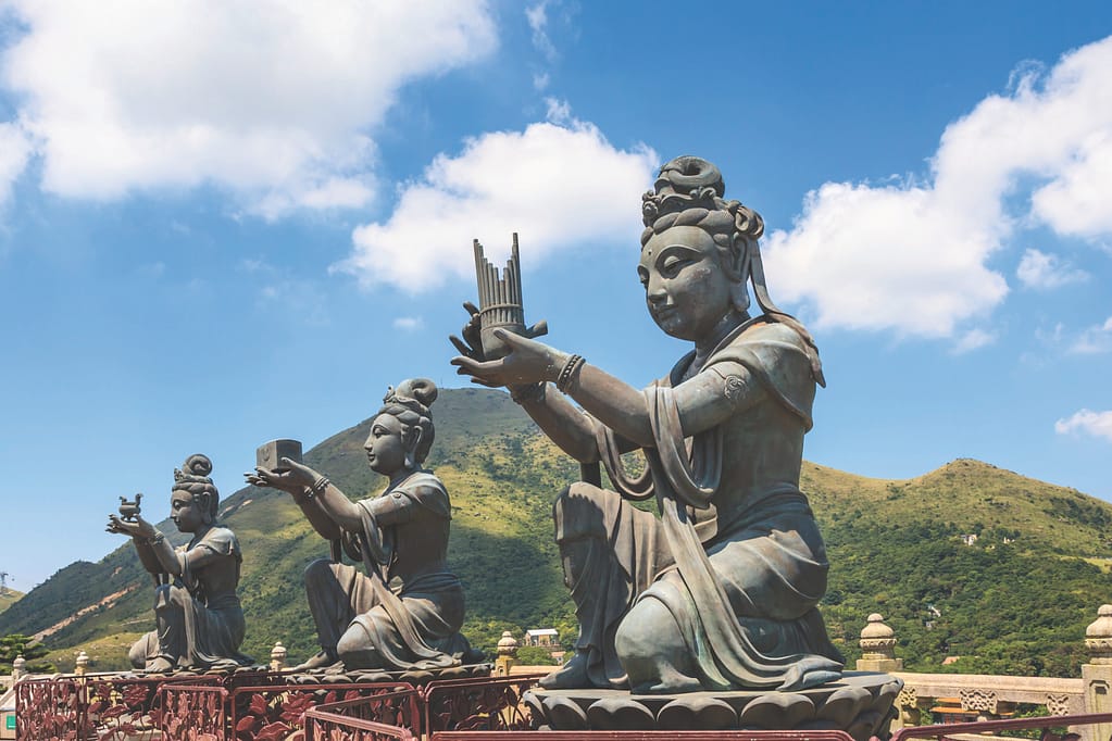 Statues of Devas making offerings at Tian Tan Buddha image on Lantau Island, Hong Kong