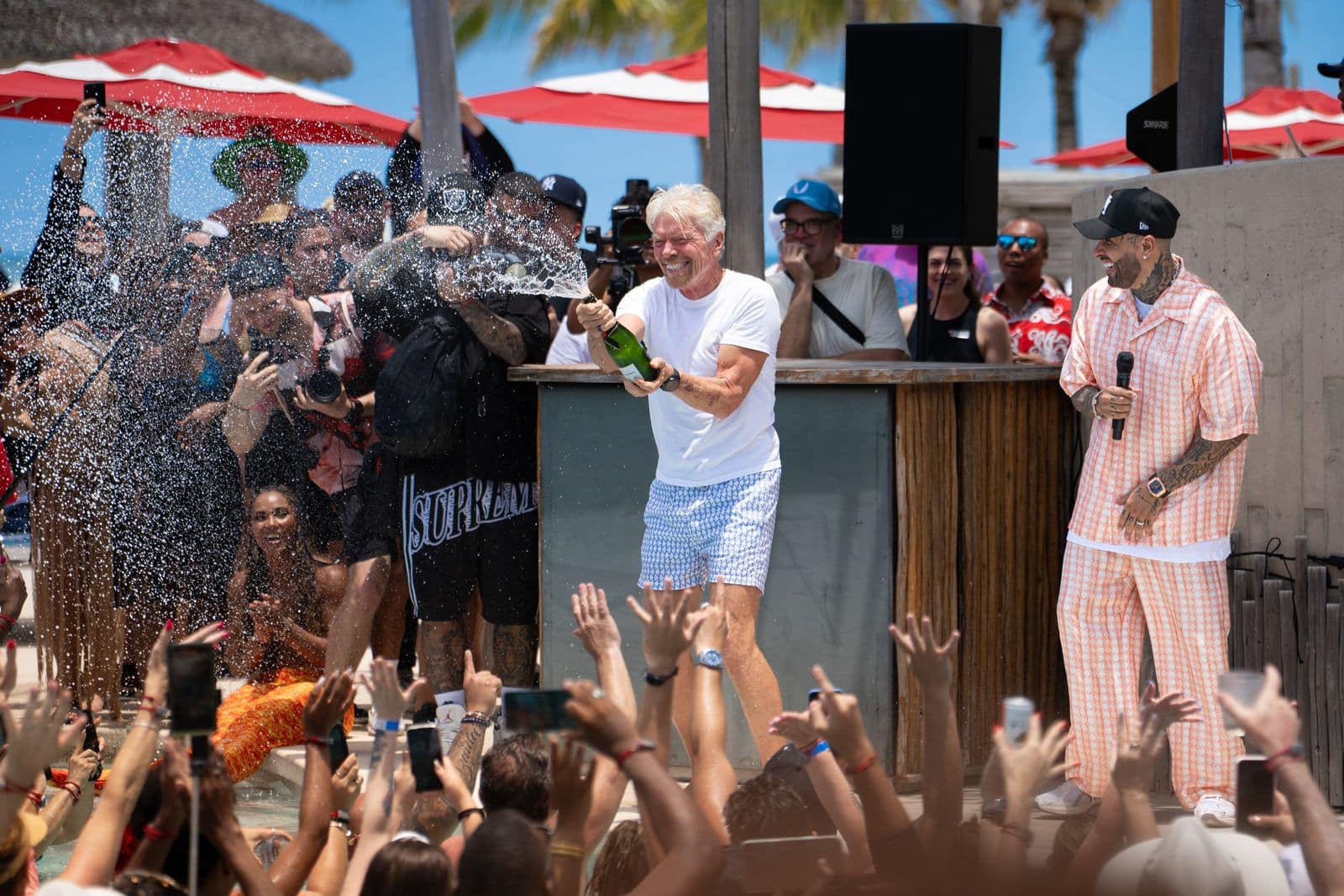 Nicky Jam and Richard Branson Spraying Champagne