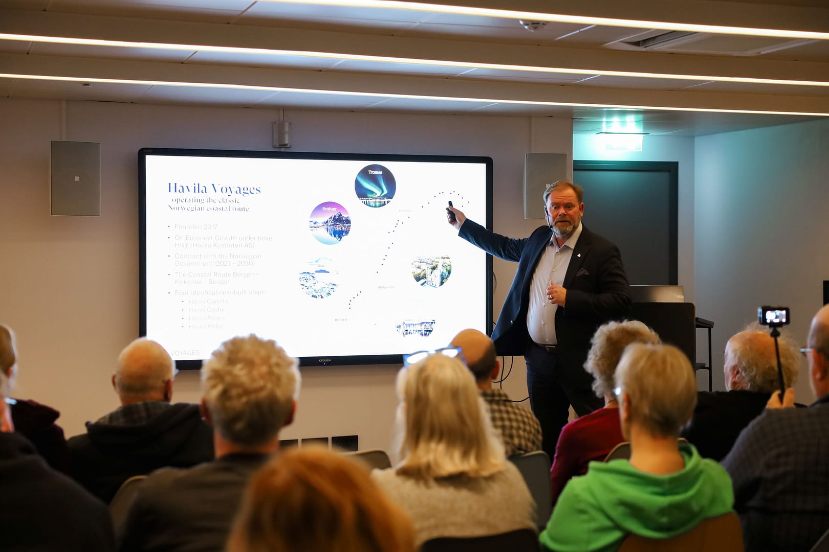 Bent Martini, CEO of Havila Voyages, holds a presentation for guests on board Havila Polaris